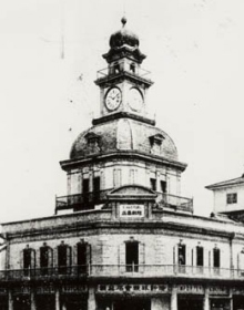 store with a clock tower